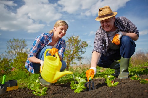 Garden worker reviewing safe procedures before continuing work